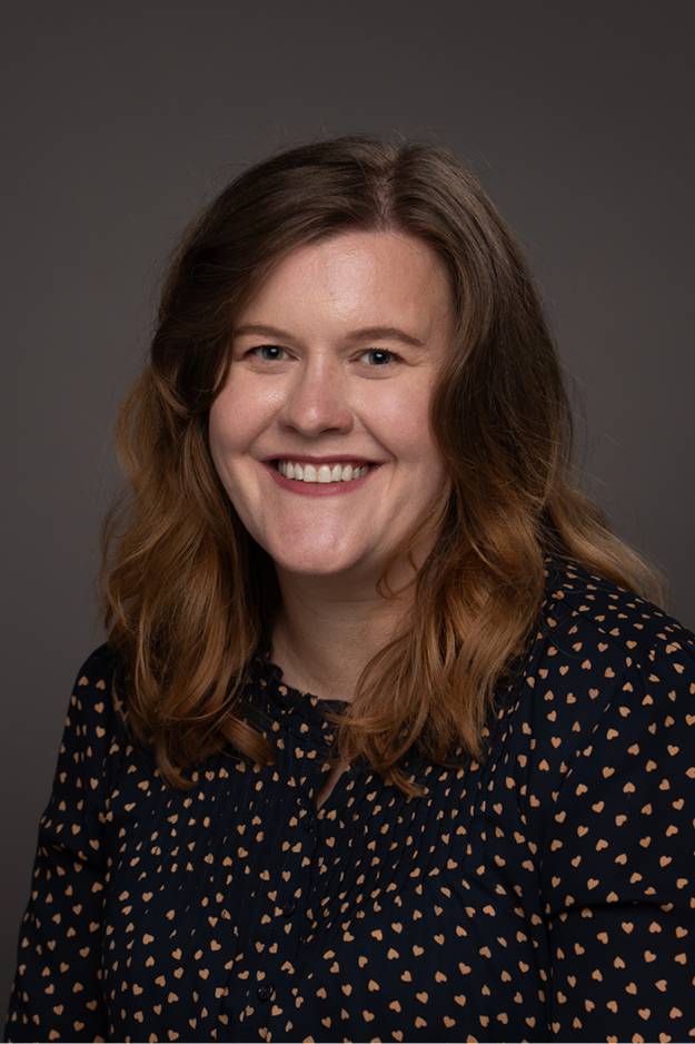 Carrie Dykstra smiling for her GVSU headshot